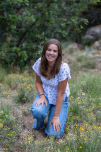 Littleton high school senior photographer Colorado graduate photography portrait session mountains Mt. Falcon foothills Heritage class of 2024 flute player band wildflowers