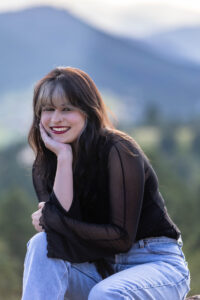 Littleton high school senior photographer teen girl Arvada West class of 2024 Mt. Falcon park Colorado wildflowers mountain view foothills photography sunset