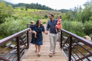 Littleton family photographer Lair O' the Bear park summer twins Colorado photography river water bridge two years old