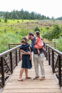Littleton family photographer Lair O' the Bear park summer twins Colorado photography river water bridge two years old