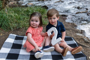 Littleton family photographer Lair O' the Bear park summer twins Colorado photography river water bridge two years old