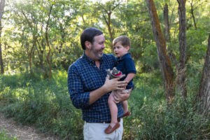 Littleton family photographer Lair O' the Bear park summer twins Colorado photography river water bridge two years old