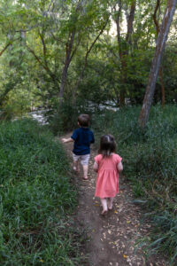 Littleton family photographer Lair O' the Bear park summer twins Colorado photography river water bridge two years old
