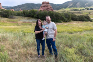 Littleton family photographer South Valley Ken Caryl park red rocks Colorado sunset photography one year old baby boy parents mother father son