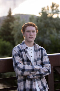 Littleton high school senior photographer Golden Colorado Clear Creek river park photography sunset foothills ginger basketball boy teenager bridge