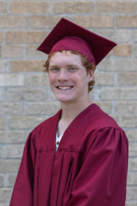 Littleton high school senior photographer Golden Colorado Clear Creek river park photography sunset foothills ginger basketball boy teenager graduation cap and gown