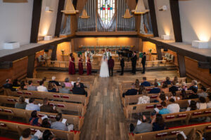 Littleton wedding photographer church bride and groom Colorado photography Lutheran ceremony dress vows marriage married reception cake