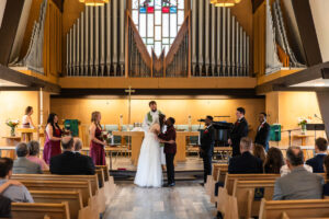 Littleton wedding photographer church bride and groom Colorado photography Lutheran ceremony dress vows marriage married reception cake
