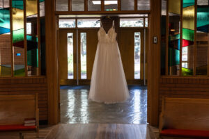 Littleton wedding photographer church bride and groom Colorado photography Lutheran ceremony dress vows marriage married reception cake