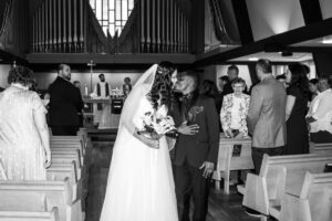 Littleton wedding photographer church bride and groom Colorado photography Lutheran ceremony dress vows marriage married reception cake kiss