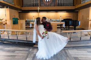 Littleton wedding photographer church bride and groom Colorado photography Lutheran ceremony dress vows marriage married reception cake dip kiss