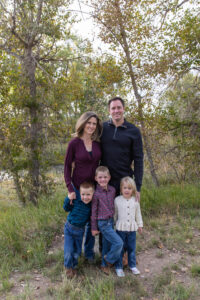 Littleton family photographer McCabe Meadows Colorado sunset photography twins kids mother father son daughter river bridge siblings
