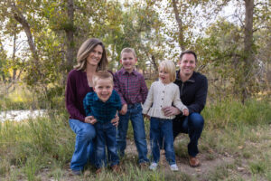 Littleton family photographer McCabe Meadows Colorado sunset photography twins kids mother father son daughter river bridge siblings