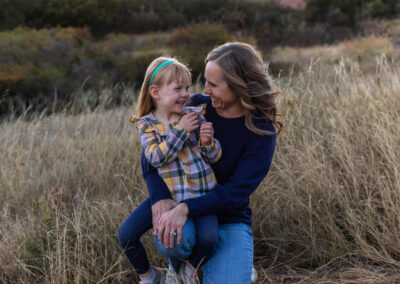 Littleton family photographer mother father daughter South Valley Open Space park Ken Caryl red rocks Colorado foothills photography sunset