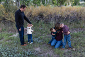 Littleton family photographer McCabe Meadows Colorado sunset photography twins kids mother father son daughter river bridge