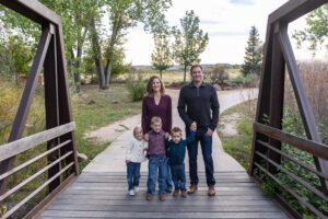 Littleton family photographer McCabe Meadows Colorado sunset photography twins kids mother father son daughter river bridge siblings