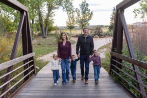Littleton family photographer McCabe Meadows Colorado sunset photography twins kids mother father son daughter river bridge