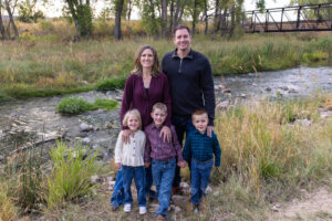 Littleton family photographer McCabe Meadows Colorado sunset photography twins kids mother father son daughter river bridge