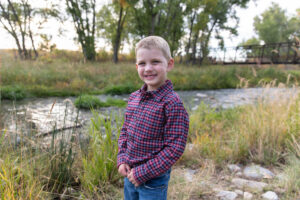 Littleton family photographer McCabe Meadows Colorado sunset photography twins kids mother father son daughter river bridge