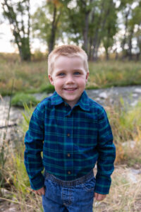 Littleton family photographer McCabe Meadows Colorado sunset photography twins kids mother father son daughter river bridge