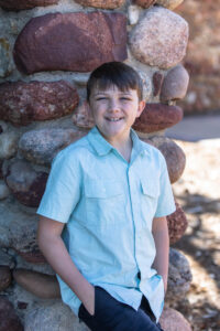 Littleton family photographer Highlands Ranch Mansion photographer Colorado stone wall teen boy brother