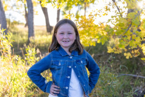 Littleton family photographer McCabe Meadows Parker sunset fall Colorado photography kids brother sister siblings mother father son daughter creek water bridge