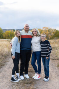 Littleton family photographer fall leaves Chatfield State Park Colorado color photography sunset siblings brother sister mother father daughter son
