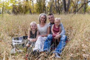 Littleton family photographer Chatfield State park Colorado fall leaves sisters girls photography mother father daughters