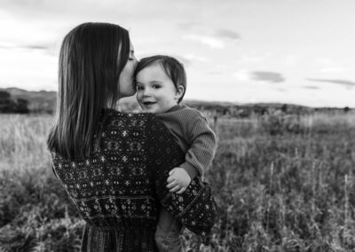 Littleton family photographer mother son Colorado foothills kisses sunset photography