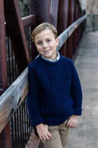 Littleton family photographer urban photo session Downtown Littleton fall Colorado photography boys brothers mother father sons alley bridge river town Red Rocks