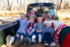 Littleton family photographer mini holiday photo session Santa Claus vintage truck Christmas Chatfield State park Colorado photography