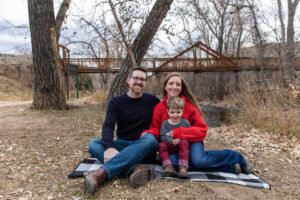 Littleton family photographer Morrison Park bridge boy father mother son two photography river creek water
