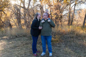 Littleton family photographer Hildebrand Ranch fall Colorado sunset photography baby boy mother father son foothills leaves