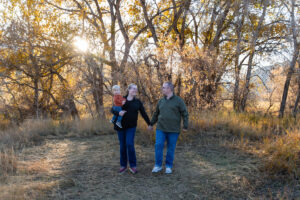 Littleton family photographer Hildebrand Ranch fall Colorado sunset photography baby boy mother father son foothills leaves