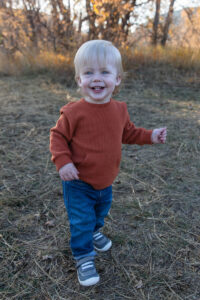 Littleton family photographer Hildebrand Ranch fall Colorado sunset photography baby boy mother father son foothills leaves