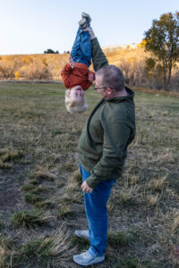 Littleton family photographer Hildebrand Ranch fall Colorado sunset photography baby boy mother father son foothills leaves
