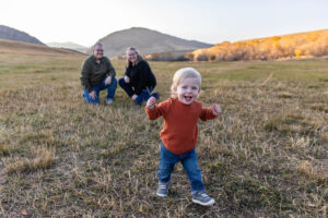 Littleton family photographer Hildebrand Ranch fall Colorado sunset photography baby boy mother father son foothills leaves