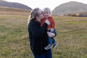 Littleton family photographer Hildebrand Ranch fall Colorado sunset photography baby boy mother father son foothills leaves