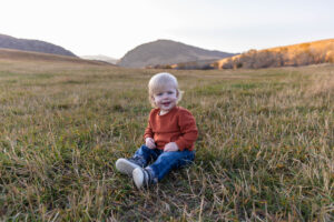 Littleton family photographer Hildebrand Ranch fall Colorado sunset photography baby boy mother father son foothills leaves