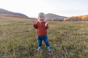 Littleton family photographer Hildebrand Ranch fall Colorado sunset photography baby boy mother father son foothills leaves