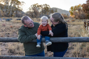 Littleton family photographer Hildebrand Ranch fall Colorado sunset photography baby boy mother father son foothills leaves