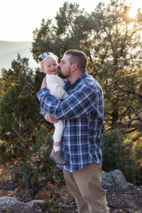 Littleton family photographer mother father daughter two year old girl Mt. Falcon park sunset cold fall Colorado photography