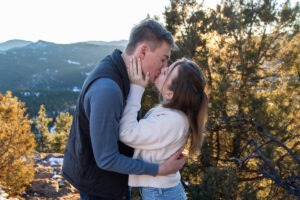 Littleton family photographer engagement session engaged marriage future bride groom Mt. Falcon park sunset photography Colorado in love kiss