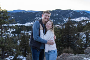 Littleton family photographer engagement session engaged marriage future bride groom Mt. Falcon park sunset photography Colorado in love ring