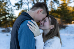 Littleton family photographer engagement session engaged marriage future bride groom Mt. Falcon park sunset photography Colorado in love ring