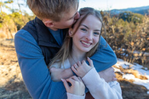 Littleton family photographer engagement session engaged marriage future bride groom Mt. Falcon park sunset photography Colorado in love ring diamond
