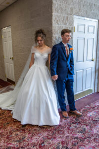 Littleton wedding photographer Colorado bride and groom church photography bridesmaids groomsmen flowers Standley Lake sunset photos first touch