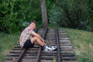 Littleton family and high school senior photographer Morrison Colorado photography CU buffs college bound church Platt Park boy Heritage teenager drums urban railroad tracks