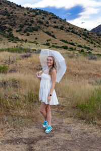 Littleton family and high school senior photographer Morrison Colorado photography CU buffs college bound church Platt Park boy Heritage teenager drums umbrella rain red rocks