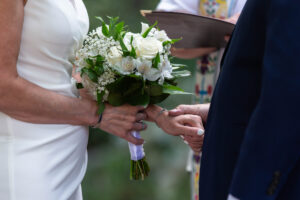 Littleton wedding photographer bride and groom park ceremony Colorado photography bridesmaids groomsmen best man foothills bouquet flowers river rain small